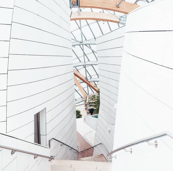 Bright stairwell and atrium with white balustrades.