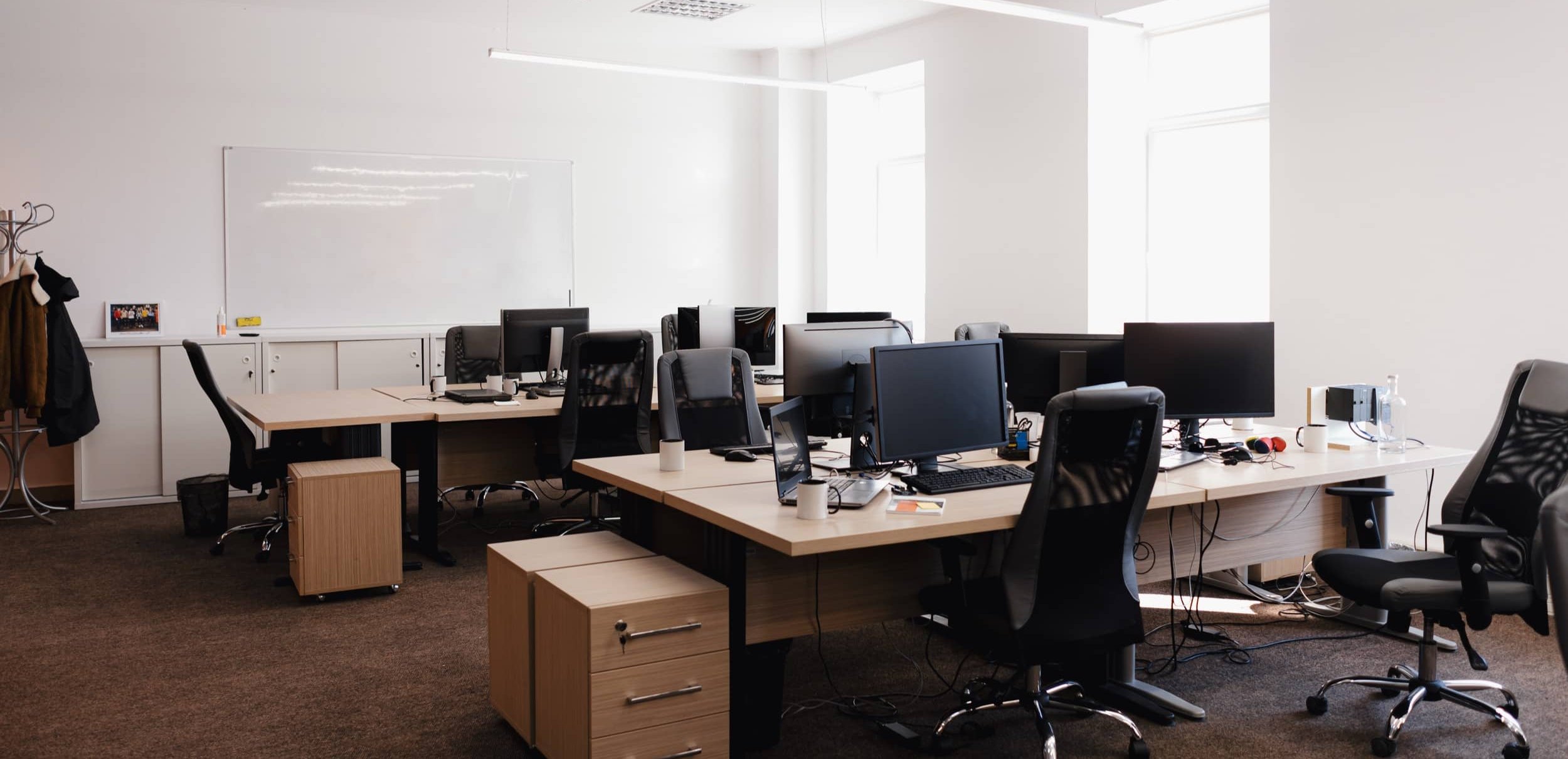 Clean, empty open plan office ready for the working day.